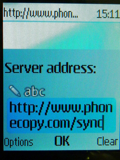 Type http://www.phonecopy.com/sync into the server address field